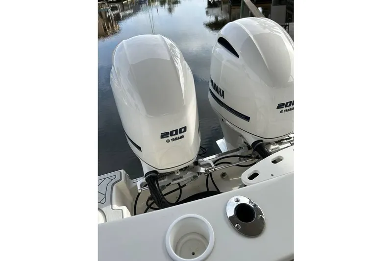 Slide: The Image of Twin Yamaha 200 engines on a 2016 Sailfish 275 DC boat. - 4