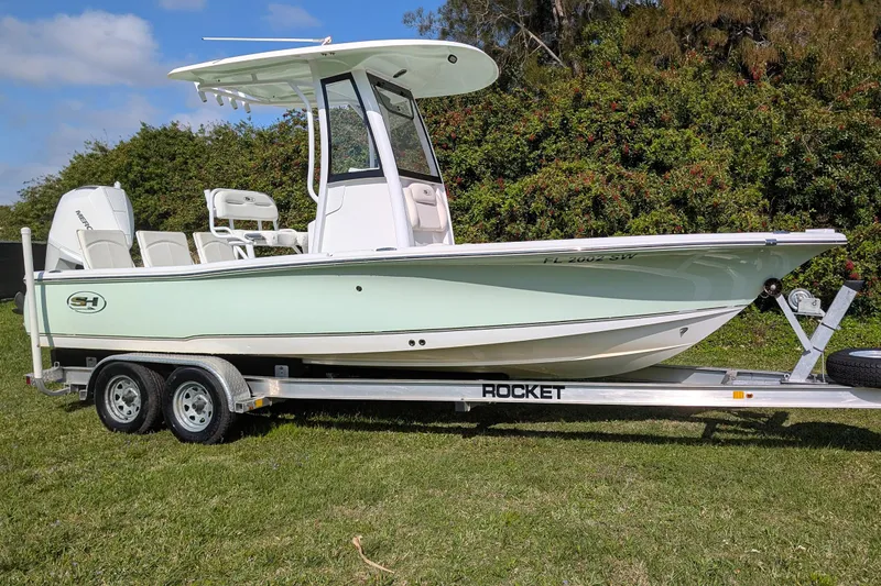 The Image of 2021 Sea Hunt BX 22 BR boat on trailer, parked on grass. - 0