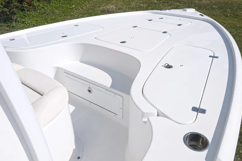 Slide: The Image of 2021 Sea Hunt BX 22 BR boat deck with storage compartments and seating. - 10