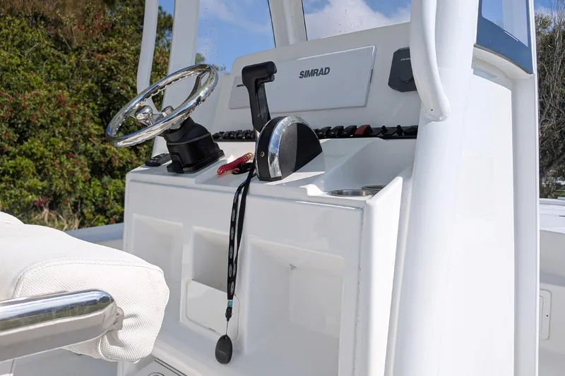 Slide: The Image of 2021 Sea Hunt BX 22 BR boat console with steering wheel and controls. - 11