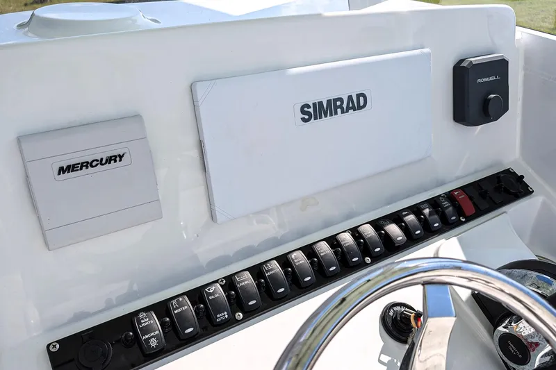 Slide: The Image of Control panel of 2021 Sea Hunt BX 22 BR boat with Simrad and Mercury systems. - 13