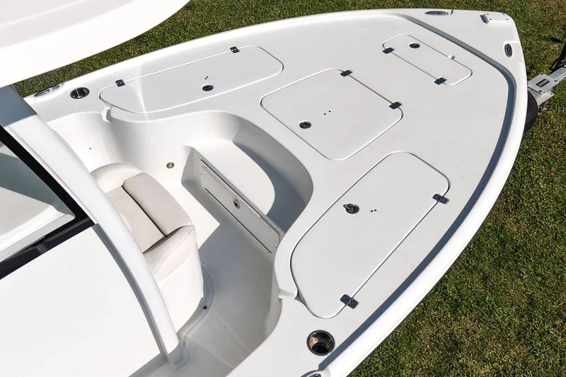 Slide: The Image of 2021 Sea Hunt BX 22 BR boat deck with storage compartments and seating. - 17