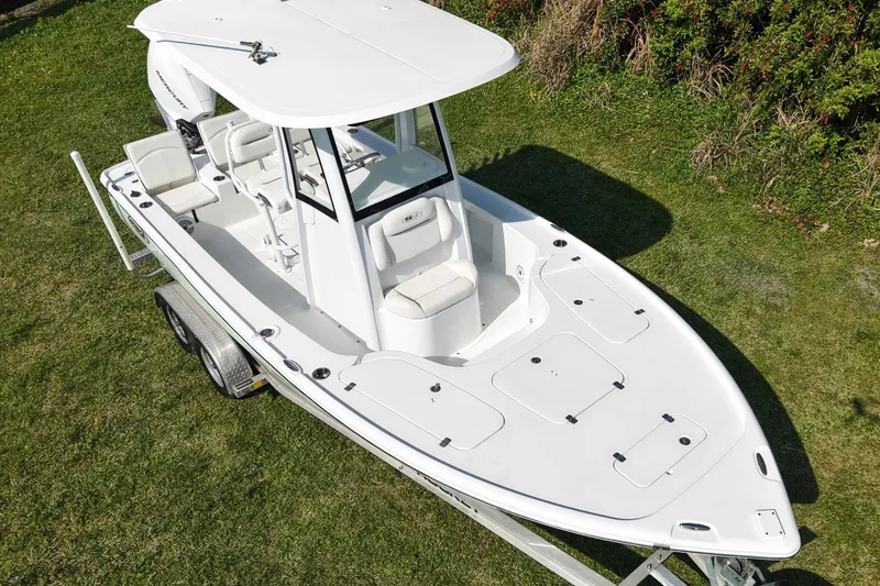 Slide: The Image of 2021 Sea Hunt BX 22 BR boat on trailer, viewed from above on grass. - 18