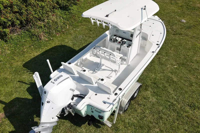Slide: The Image of 2021 Sea Hunt BX 22 BR boat on trailer, viewed from above on grass. - 19