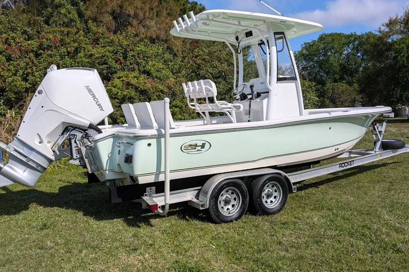 Slide: The Image of 2021 Sea Hunt BX 22 BR boat on trailer, featuring Mercury outboard motor. - 3