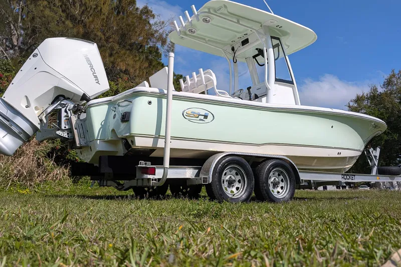 Slide: The Image of 2021 Sea Hunt BX 22 BR boat on trailer, featuring Mercury outboard motor. - 4