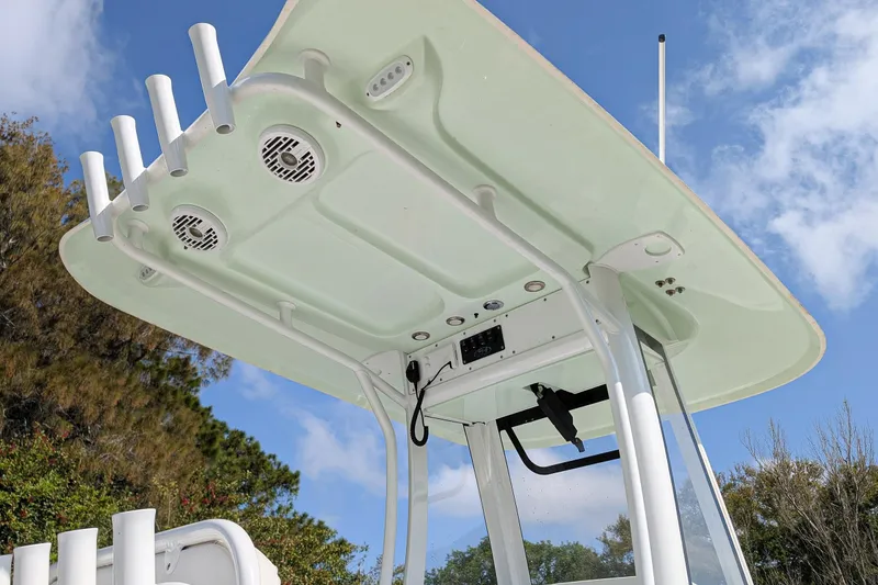 Slide: The Image of 2021 Sea Hunt BX 22 BR boat's T-top with rod holders and speakers. - 6