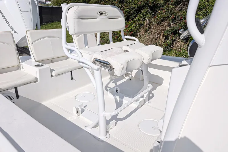 Slide: The Image of 2021 Sea Hunt BX 22 BR boat interior with white seating and console. - 8