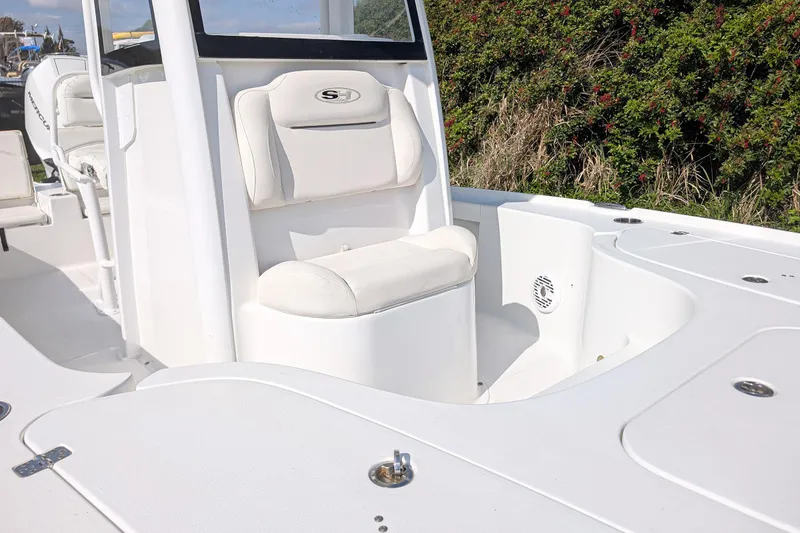 Slide: The Image of 2021 Sea Hunt BX 22 BR boat interior with white seating and console. - 9