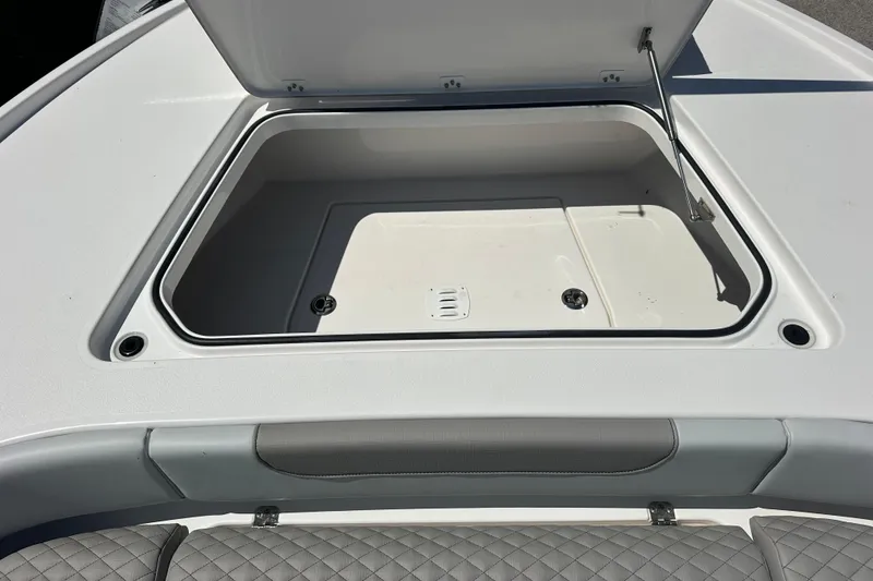 Slide: The Image of Open storage compartment on 2026 Caymas 26 HB boat deck. - 15