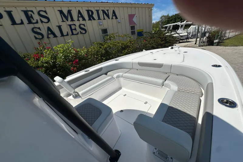 Slide: The Image of 2026 Caymas 26 HB boat interior at marina sales location. - 5