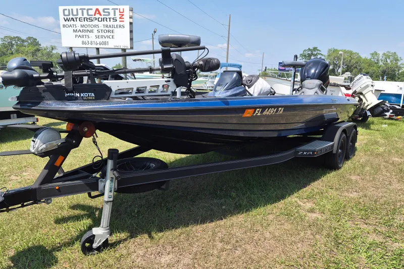 Slide: The Image of 2021 Skeeter ZXR20 boat on trailer at Outcast Watersports dealership. - 2
