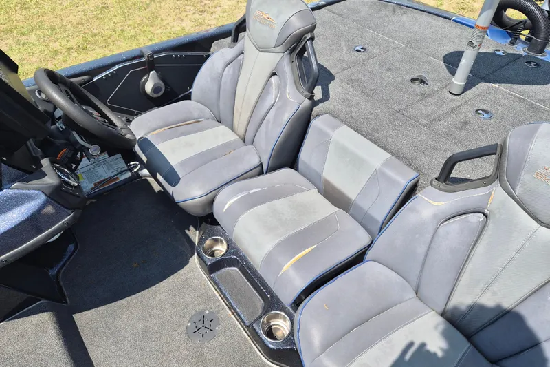 Slide: The Image of Interior of a 2021 Skeeter ZXR20 boat with gray seating and steering wheel. - 6