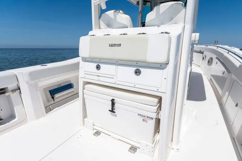 Slide: The Image of 2021 Caymas 341 CC boat interior with storage and seating, ocean view. - 10