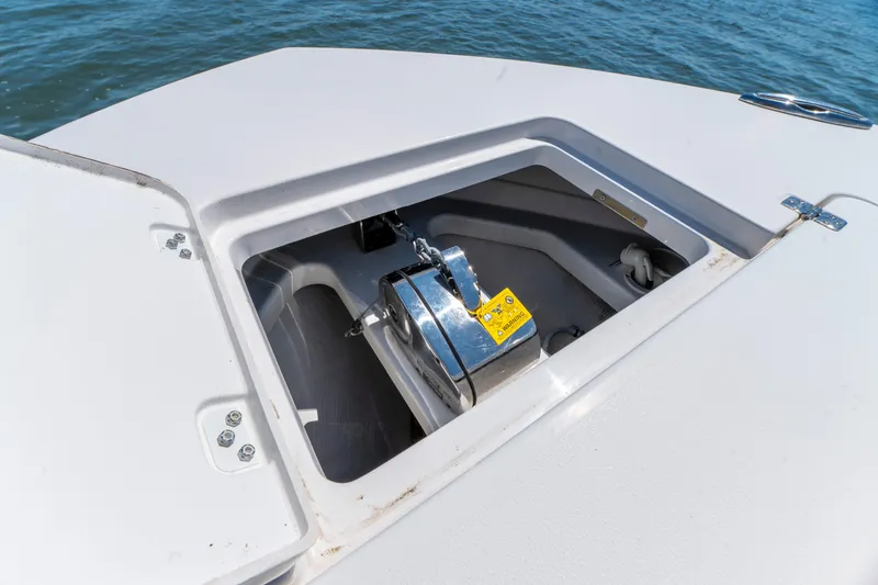 Slide: The Image of Anchor compartment of 2021 Caymas 341 CC boat on water. - 23