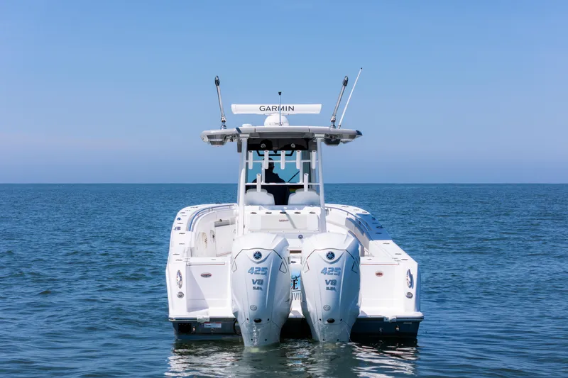 Slide: The Image of 2021 Caymas 341 CC boat with dual engines on open water. - 3