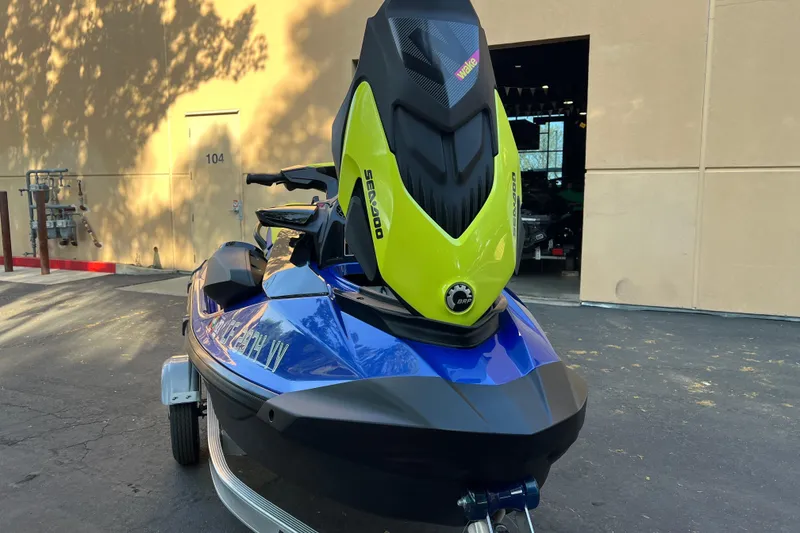 Slide: The Image of 2021 Sea-Doo Wake 170 jet ski on trailer, parked outdoors. - 15