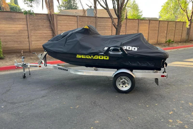 Slide: The Image of 2021 Sea-Doo Wake 170 on trailer, covered, parked outdoors. - 16