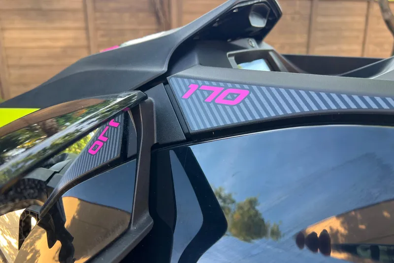 Slide: The Image of Close-up of 2021 Sea-Doo Wake 170 with pink "170" decal detail. - 8