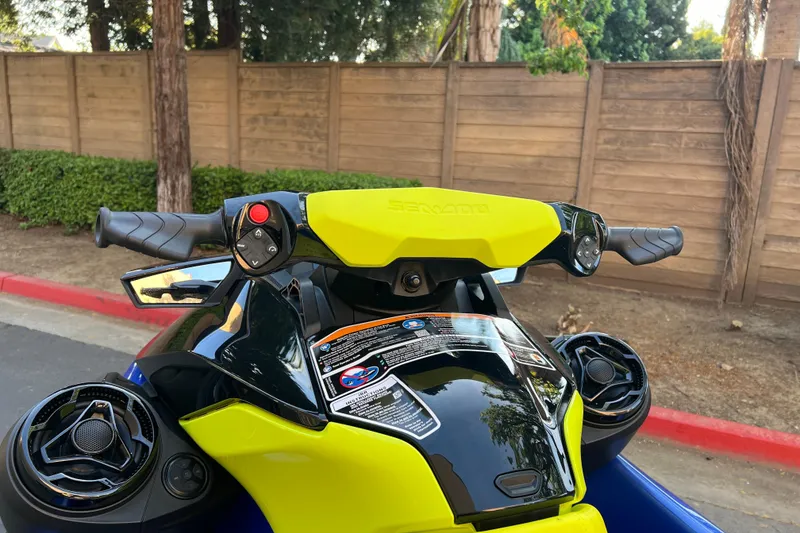 Slide: The Image of 2021 Sea-Doo Wake 170 handlebars and controls, vibrant yellow and black design. - 9