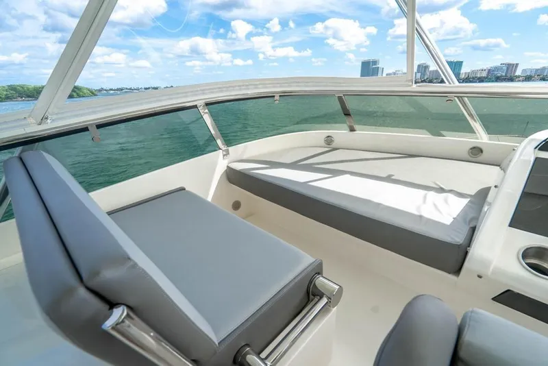 Slide: The Image of Luxurious seating area on 2020 Fairline 68 yacht with scenic ocean view. - 15