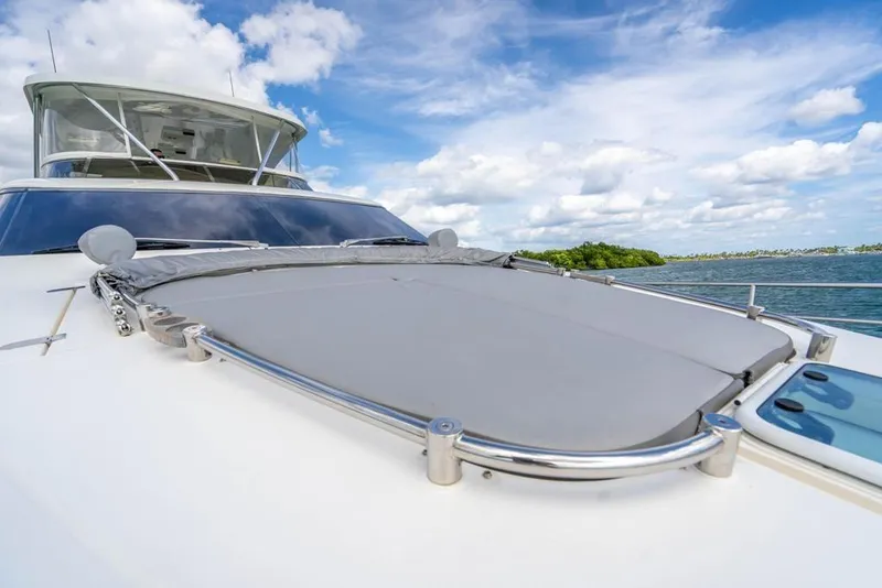 Slide: The Image of Luxury Fairline 68 yacht deck with sunpad, 2020 model, under blue sky. - 22