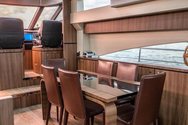 Slide: The Image of Luxurious interior of 2020 Fairline 68 yacht with elegant dining area and helm station. - 25