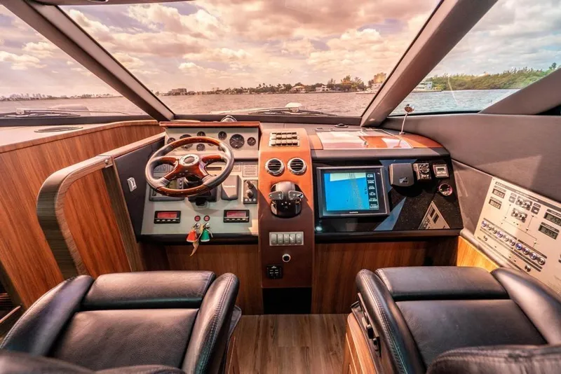 Slide: The Image of Luxurious 2020 Fairline 68 yacht cockpit with modern controls and panoramic view. - 39
