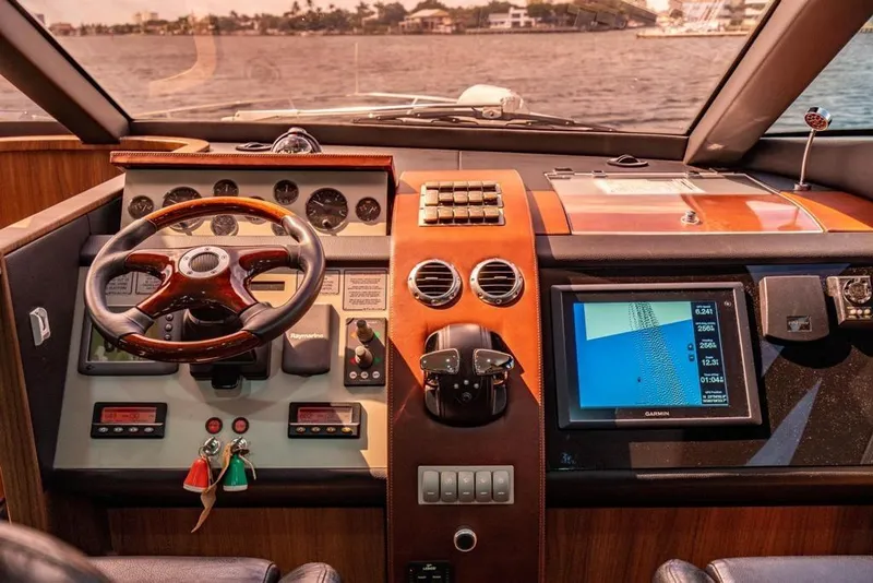 Slide: The Image of Interior cockpit of a 2020 Fairline 68 yacht with navigation controls and display. - 40