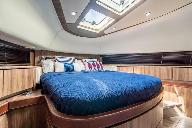 Slide: The Image of Luxurious cabin interior of 2020 Fairline 68 yacht with skylight and plush bedding. - 44
