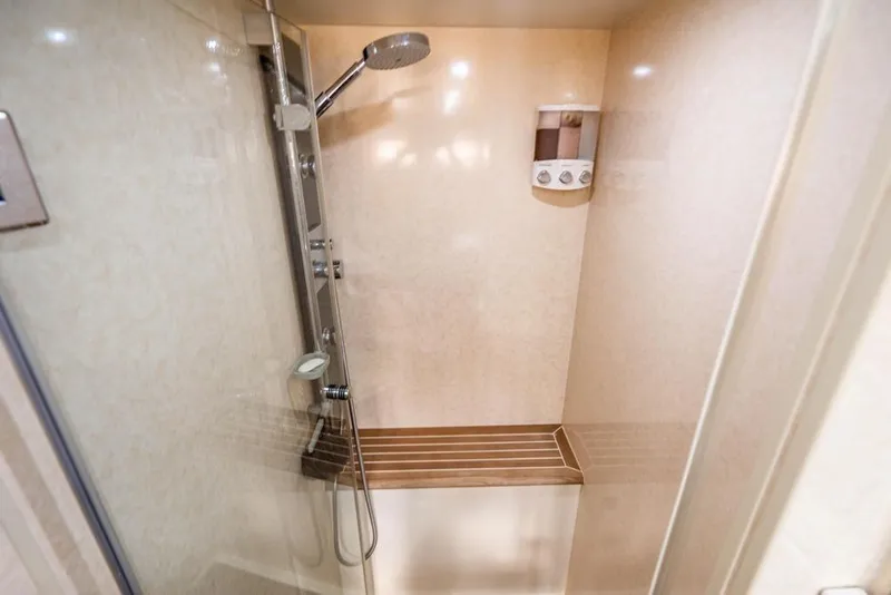 Slide: The Image of Luxurious shower area in 2020 Fairline 68 yacht, featuring modern fixtures and elegant design. - 56