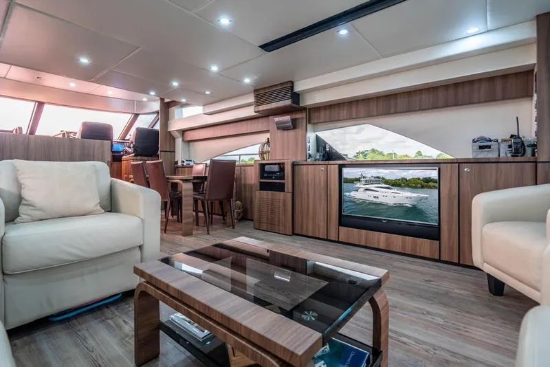 Slide: The Image of Luxurious interior of 2020 Fairline 68 yacht with modern furnishings and entertainment system. - 24