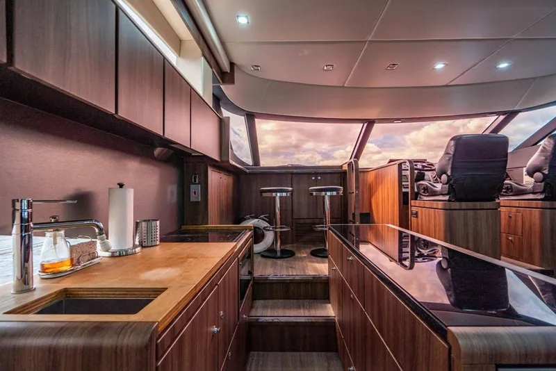 Slide: The Image of Luxurious interior of 2020 Fairline 68 yacht with modern kitchen and seating area. - 30