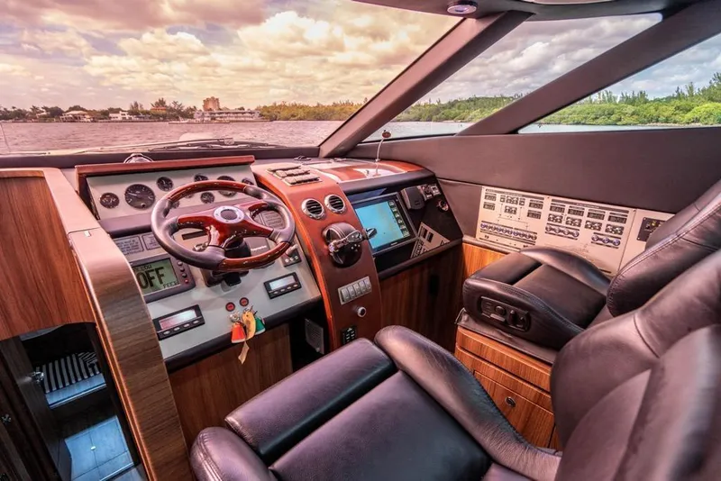 Slide: The Image of Luxurious 2020 Fairline 68 yacht cockpit with leather seats and advanced navigation controls. - 37