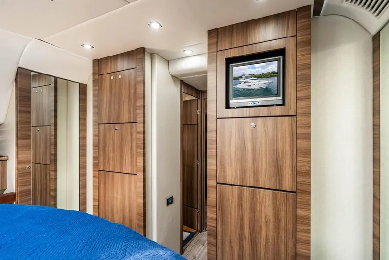 Slide: The Image of Luxurious interior of 2020 Fairline 68 yacht with wood paneling and modern amenities. - 45