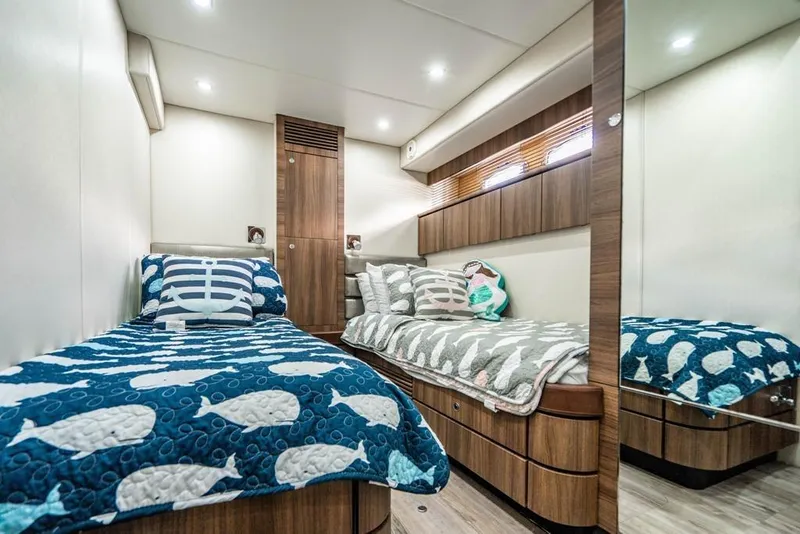 Slide: The Image of Luxurious cabin interior of 2020 Fairline 68 yacht with twin beds and nautical decor. - 47