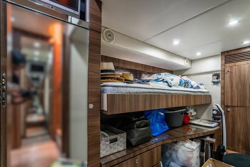 Slide: The Image of Interior of 2020 Fairline 68 yacht cabin with bunk bed and storage. - 50