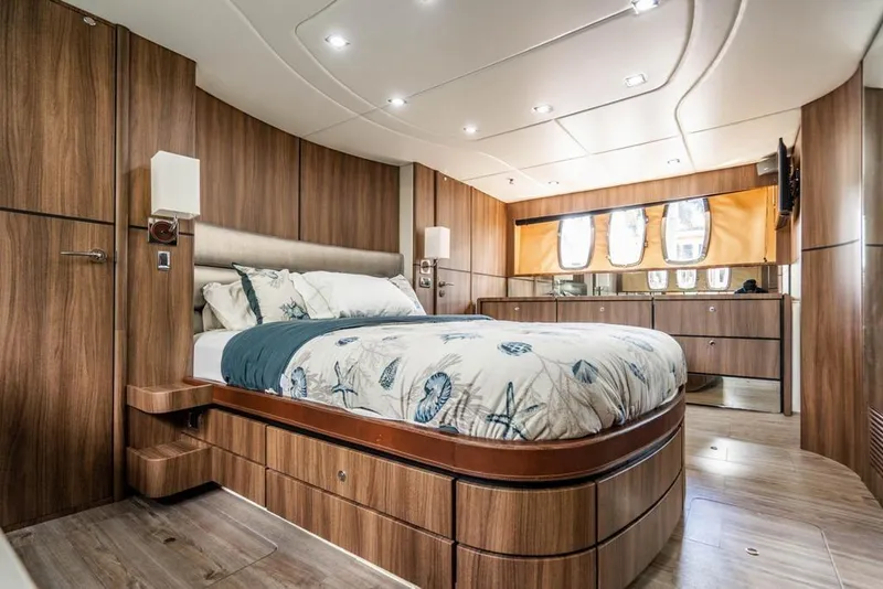 Slide: The Image of Luxurious Fairline 68 yacht bedroom interior, 2020 model, featuring elegant wood finishes and modern design. - 52