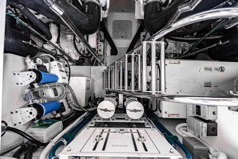 Slide: The Image of Engine room of 2020 Fairline 68 yacht, showcasing mechanical components and piping. - 59