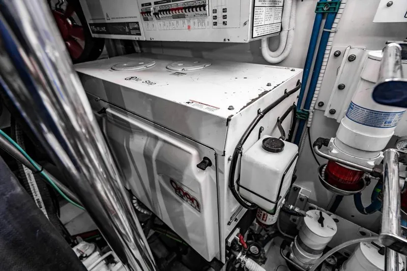 Slide: The Image of Engine room of 2020 Fairline 68 yacht, showcasing mechanical components and wiring. - 61