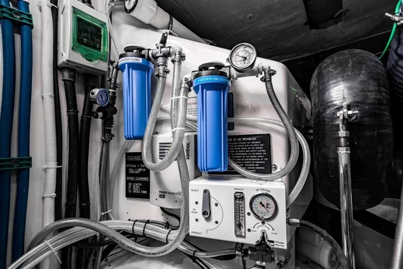 Slide: The Image of Engine room of 2020 Fairline 68 yacht with filtration system and gauges. - 62