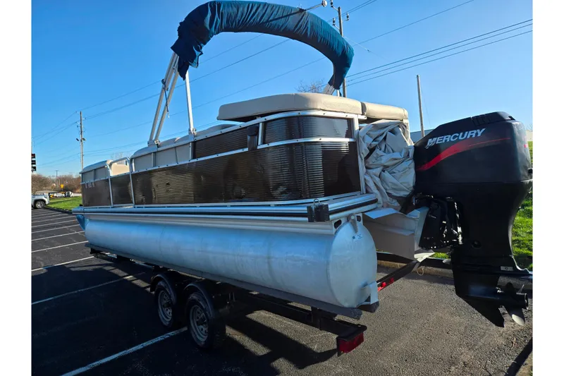 Slide: The Image of 2005 Lowe Trinidad 220 pontoon boat with Mercury outboard motor on trailer. - 3