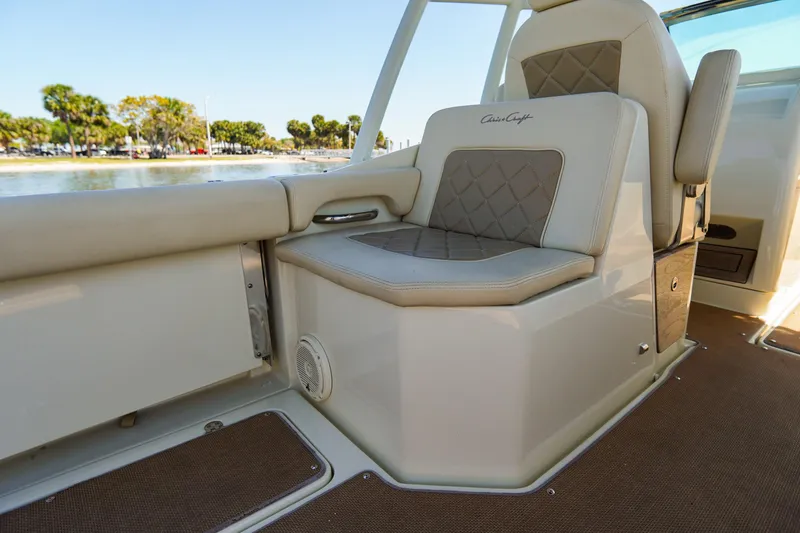 Slide: The Image of 2017 Chris-Craft Calypso 26 boat interior with cushioned seating and elegant design. - 25