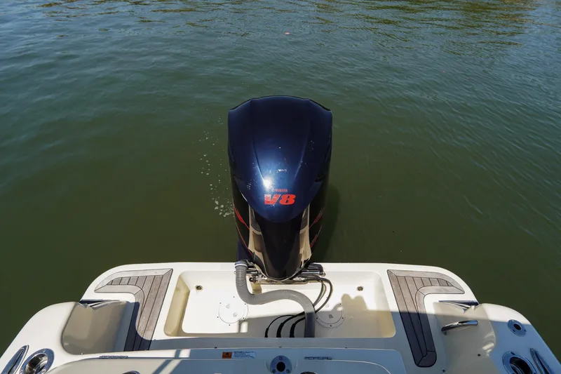 Slide: The Image of 2017 Chris-Craft Calypso 26 boat with V8 engine on water. - 27