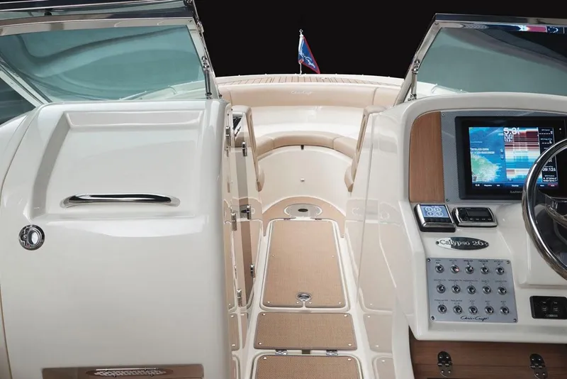 Slide: The Image of Manufacturer Provided Image: 2017 Chris-Craft Calypso 26 boat cockpit with navigation controls and seating area. - 3