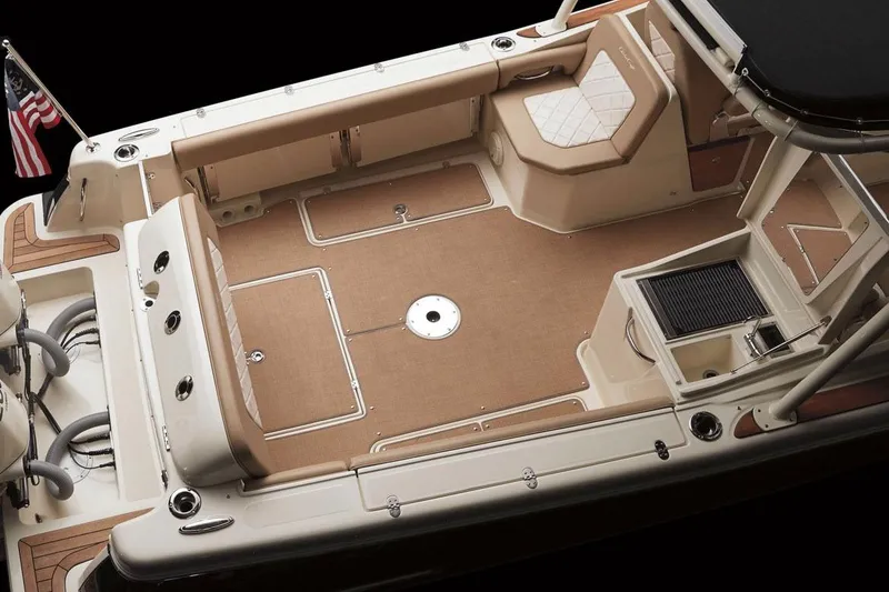 Slide: The Image of Manufacturer Provided Image: 2017 Chris-Craft Calypso 26 boat interior, spacious deck with seating and storage. - 4