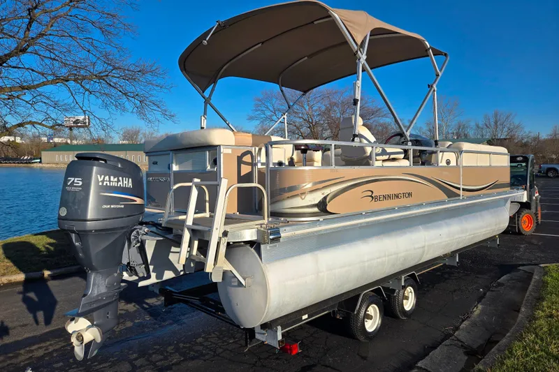 Slide: The Image of 2008 Bennington 2275RL pontoon boat with Yamaha 75 outboard motor on trailer. - 1