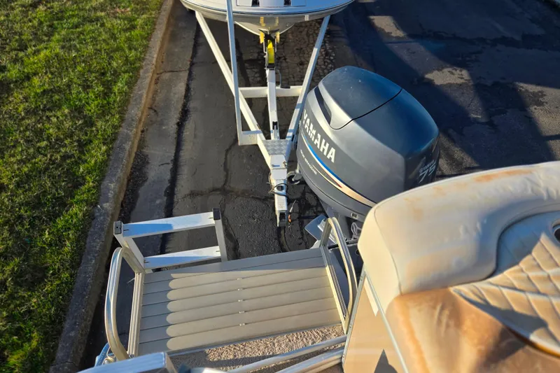 Slide: The Image of 2008 Bennington 2275RL boat with Yamaha outboard motor on a trailer. - 18