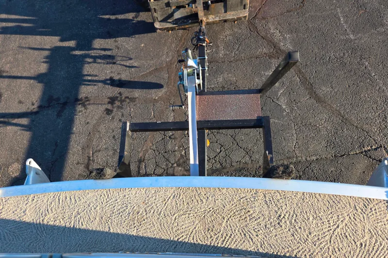Slide: The Image of Top view of a 2008 Bennington 2275RL boat trailer hitch on asphalt. - 25