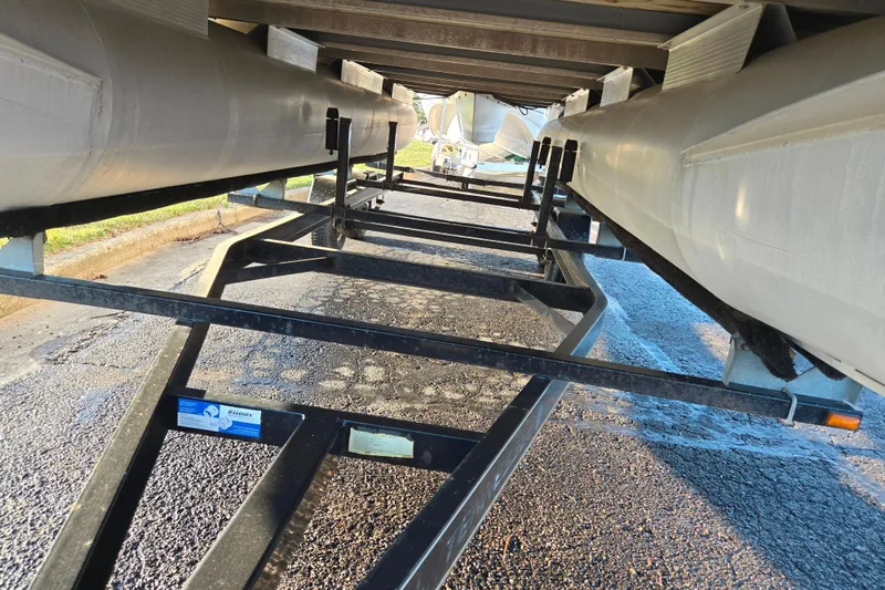 Slide: The Image of Underneath view of a 2008 Bennington 2275RL pontoon boat on a trailer. - 7